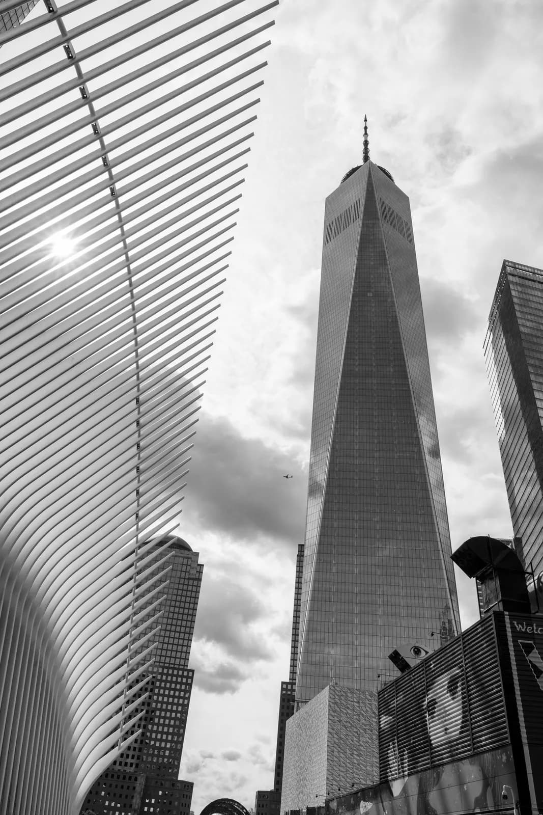 Low angle view of one world trade center and oculus structure in new york city financial district