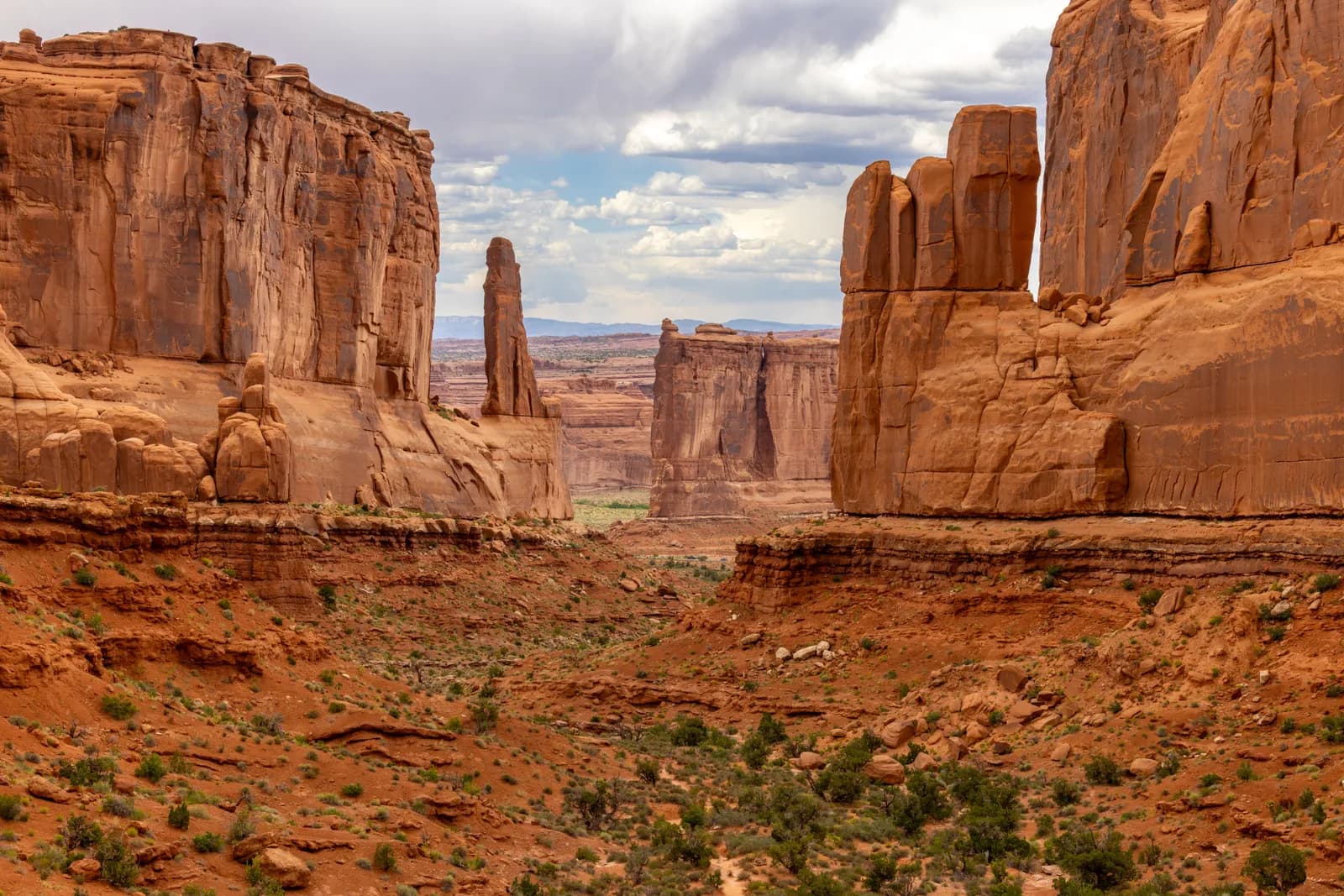 Scenic view of red rock sandstone formations in arches national park utah during a cloudy day