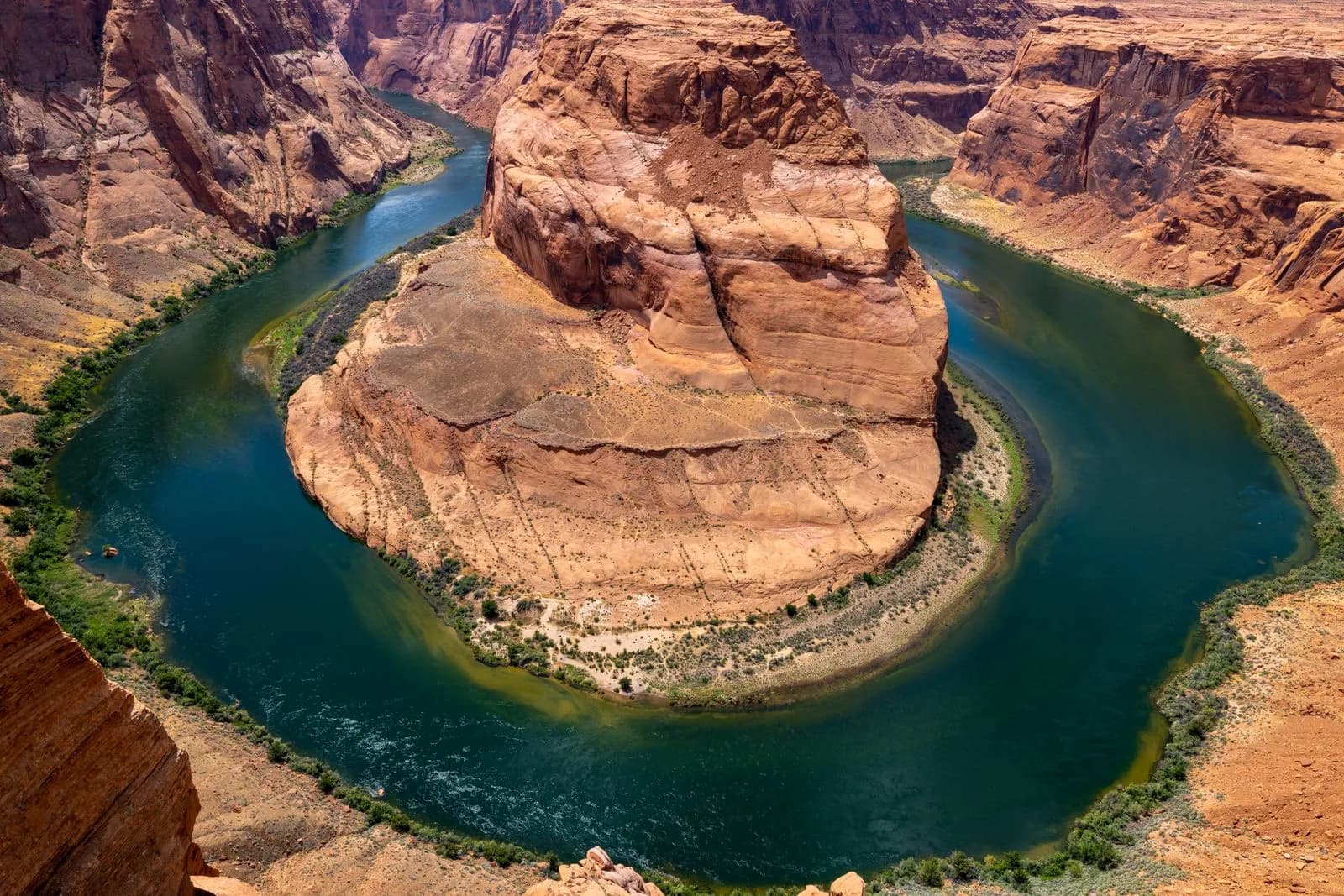 Horseshoe bend canyon landscape with colorado river flowing through arizona desert rock formations
